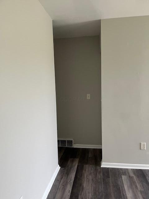 unfurnished room featuring dark hardwood / wood-style floors