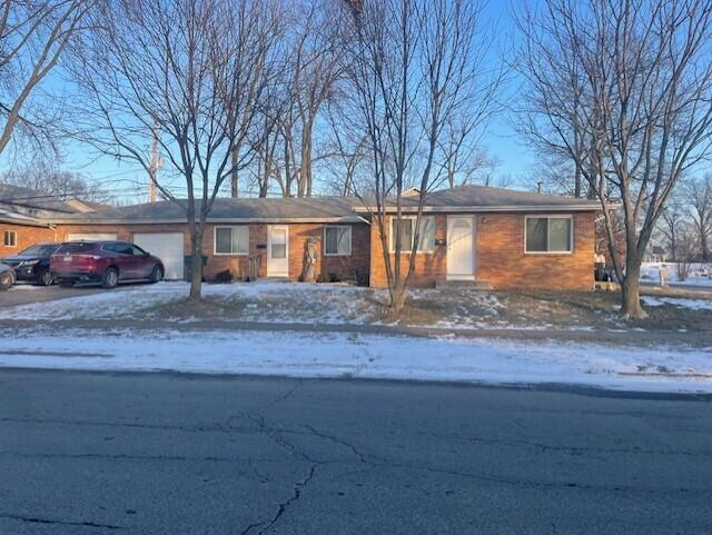 single story home with a garage