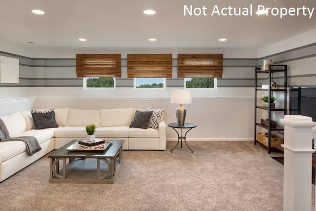 living room with recessed lighting, baseboards, and carpet