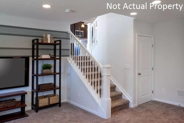 stairs with visible vents, recessed lighting, baseboards, and carpet floors