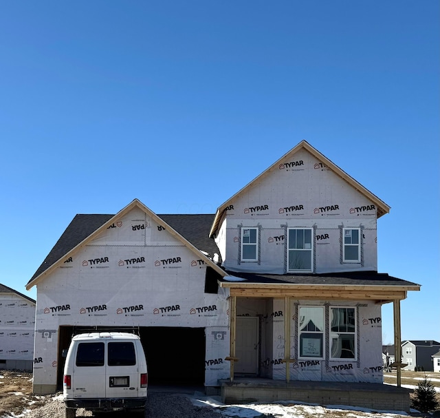 unfinished property featuring covered porch