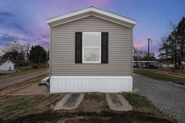 view of property exterior at dusk