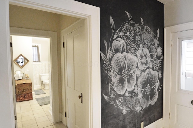 bathroom featuring tile patterned floors and toilet