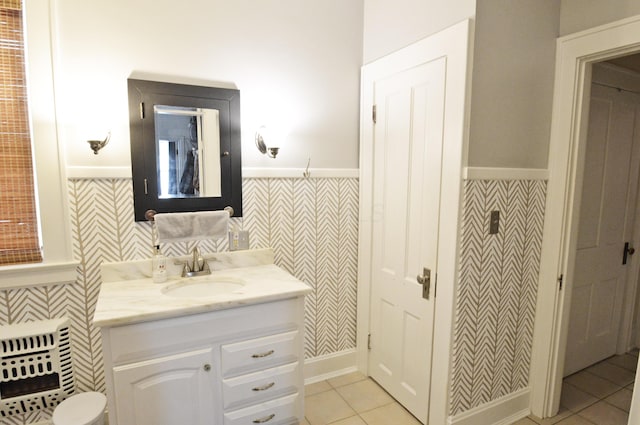 bathroom with tile patterned flooring and vanity