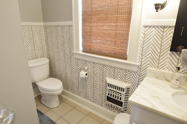 bathroom featuring tile patterned floors, toilet, and vanity