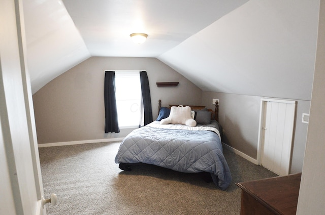 carpeted bedroom with vaulted ceiling