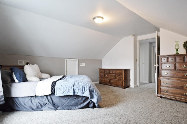 carpeted bedroom featuring vaulted ceiling