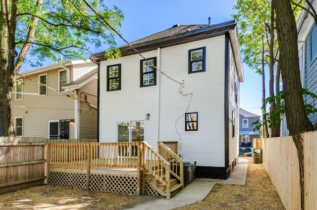 rear view of house with a wooden deck