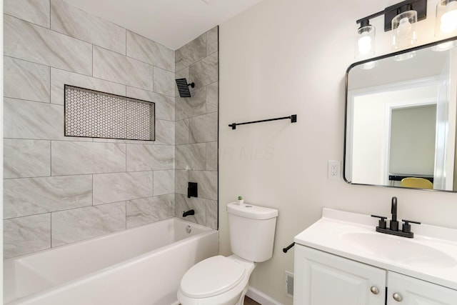 full bathroom featuring vanity, toilet, and tiled shower / bath combo