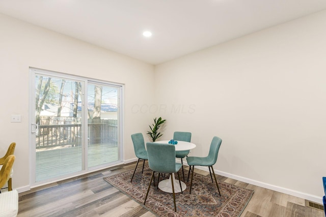 dining space featuring hardwood / wood-style floors