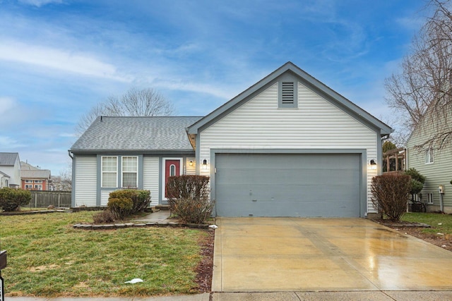 ranch-style house featuring a garage and a front yard