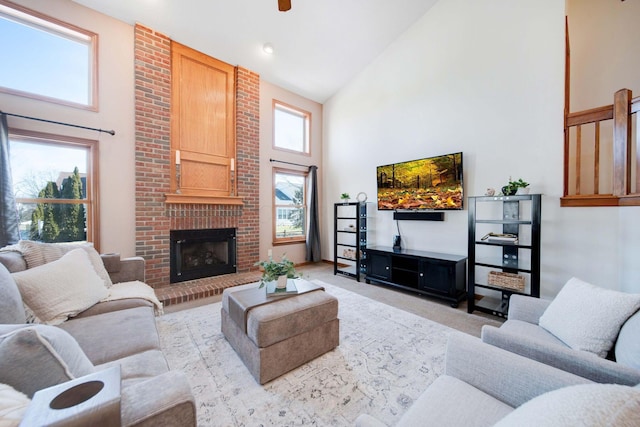 carpeted living room with a fireplace and high vaulted ceiling