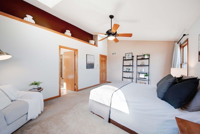 carpeted bedroom with ceiling fan and lofted ceiling