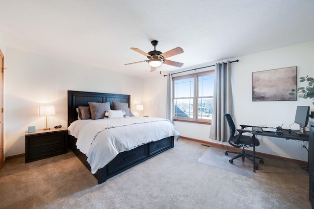 bedroom with ceiling fan and light colored carpet