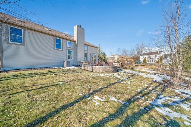 back of house featuring a yard