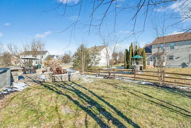 view of yard featuring a playground and central air condition unit