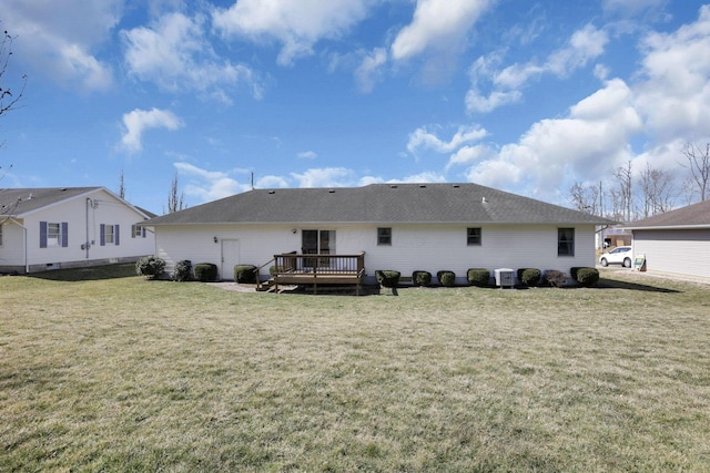 back of house with a yard and a wooden deck