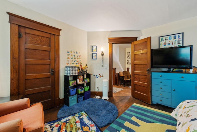 bedroom featuring dark hardwood / wood-style flooring