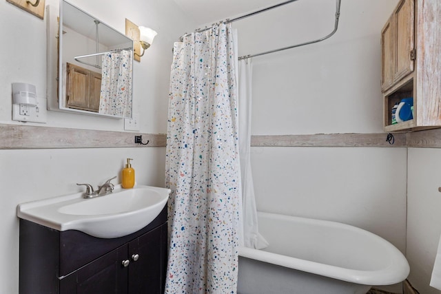 bathroom featuring vanity and shower / bath combination with curtain