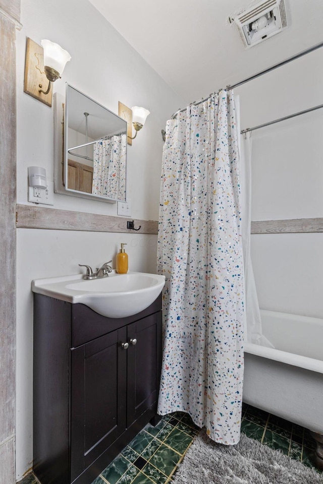 bathroom featuring vanity and shower / tub combo