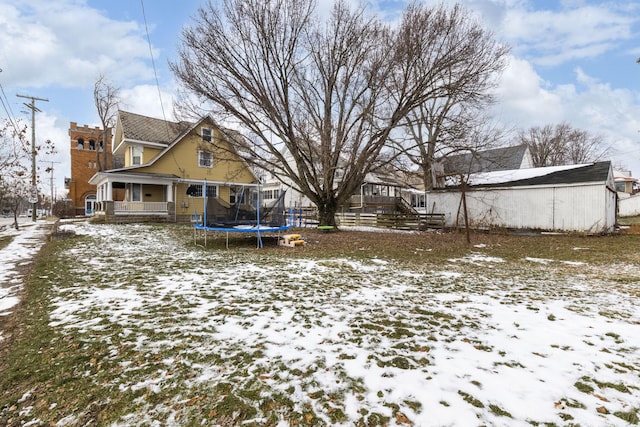 view of yard layered in snow