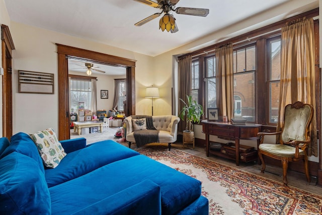 living area with ceiling fan and a wealth of natural light