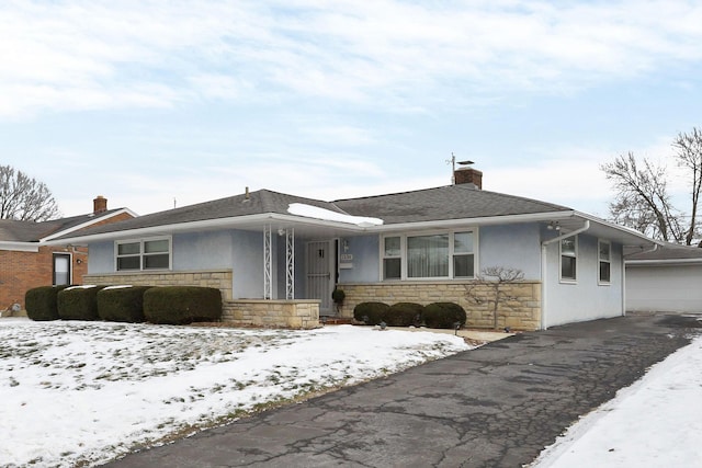 single story home featuring a garage