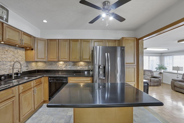 kitchen featuring a kitchen island, black dishwasher, sink, backsplash, and stainless steel refrigerator with ice dispenser