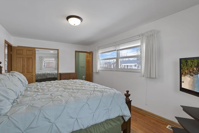 bedroom featuring hardwood / wood-style floors