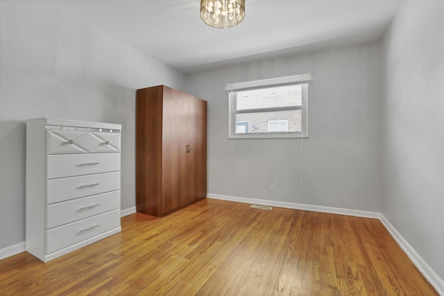 unfurnished bedroom with light hardwood / wood-style floors