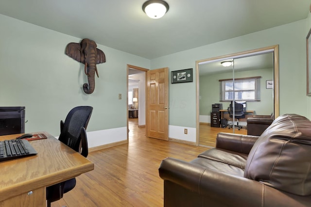 office space with light hardwood / wood-style flooring