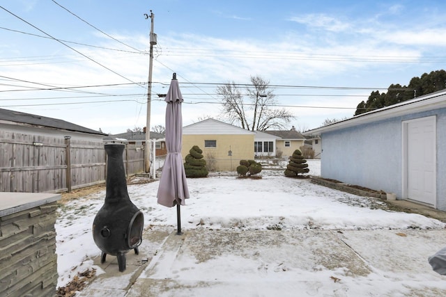 view of yard layered in snow