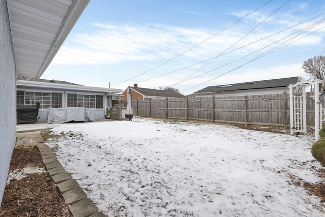 view of yard covered in snow