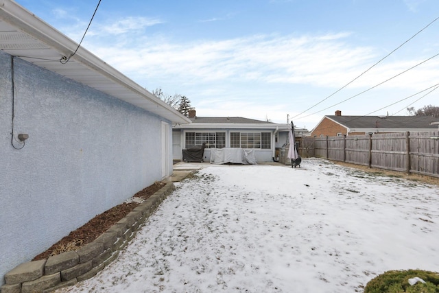 view of yard layered in snow