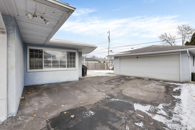 exterior space with a garage and an outdoor structure