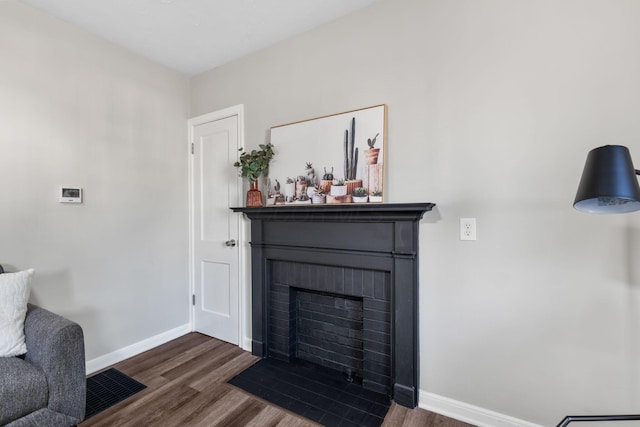 living room with dark wood-type flooring