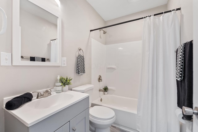 full bathroom with shower / tub combo with curtain, vanity, and toilet