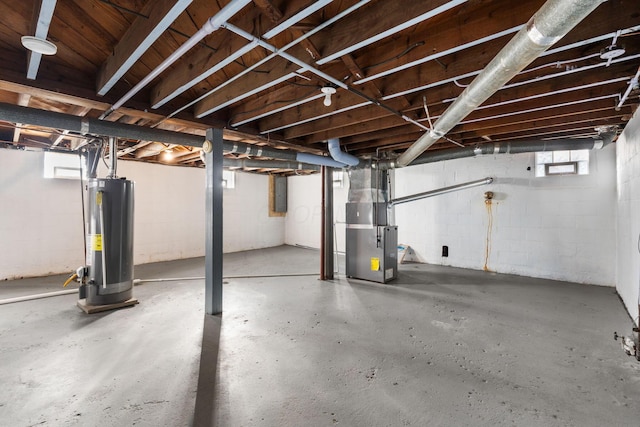 basement featuring heating unit and gas water heater