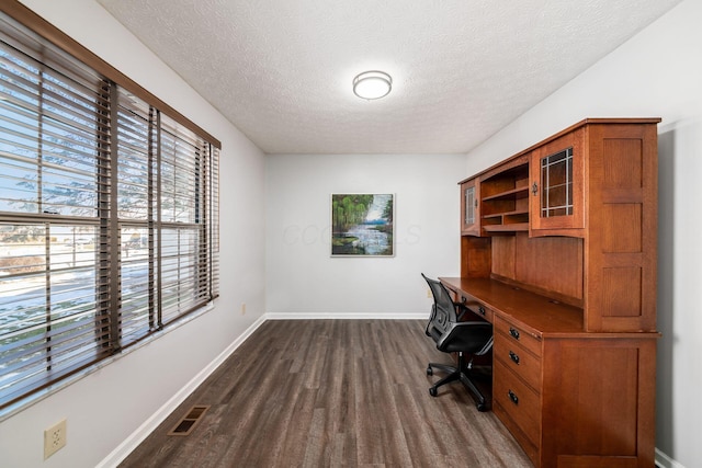 office featuring dark hardwood / wood-style flooring and a textured ceiling