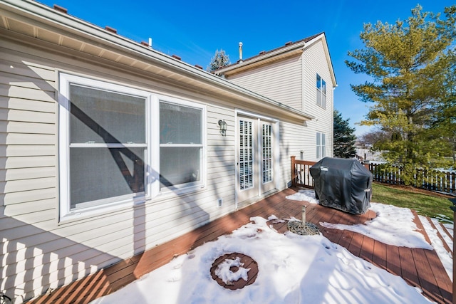 view of property exterior with a deck and a fire pit