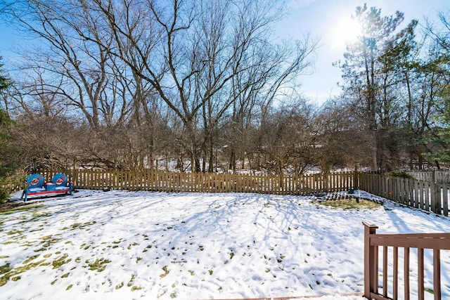 view of yard layered in snow