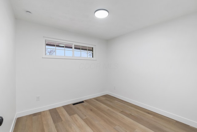 unfurnished room with light hardwood / wood-style flooring