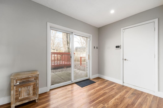 doorway to outside featuring hardwood / wood-style floors