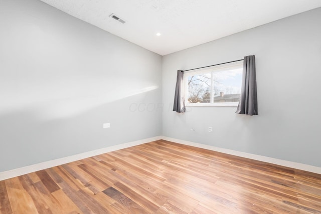 unfurnished room featuring light hardwood / wood-style flooring