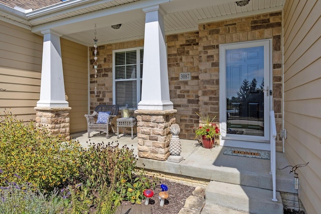 doorway to property featuring covered porch