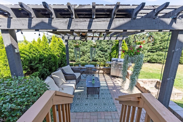 view of patio / terrace with area for grilling, an outdoor hangout area, and a pergola