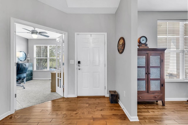 entryway with ceiling fan and light wood-type flooring