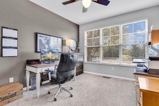 office space featuring light colored carpet and ceiling fan