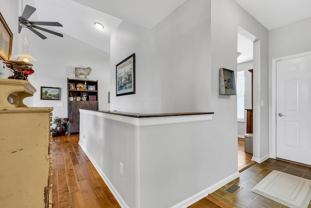 hall with hardwood / wood-style flooring