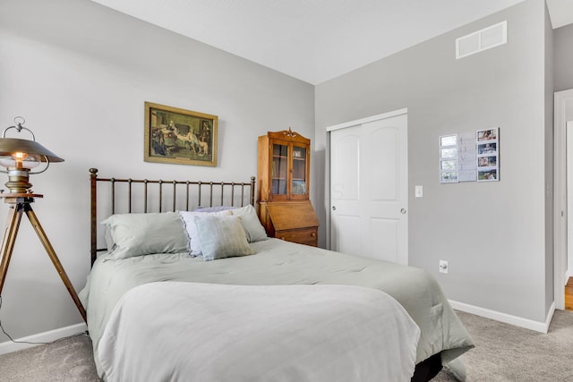 carpeted bedroom featuring a closet